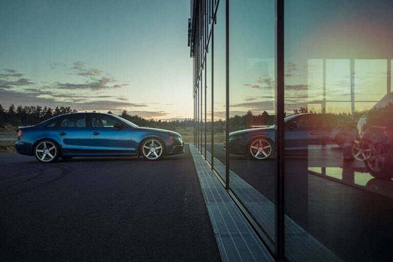 An image of a car outside of a car dealership