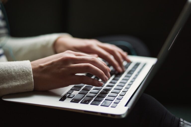 woman typing a response to internet car leads