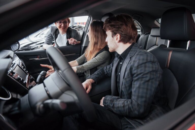 Dealership representative screening potential buyers under OFAC car dealership standards.